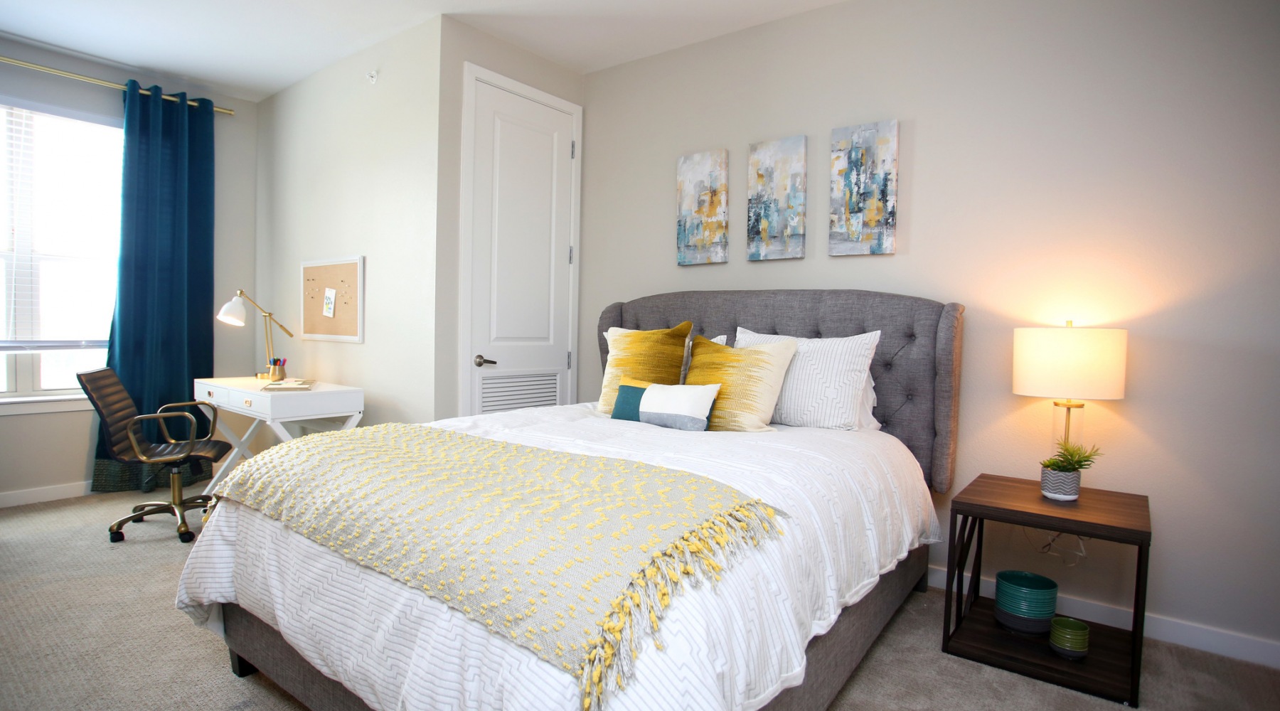 Spacious bedrooms with large windows Bedroom with lamps and a desk