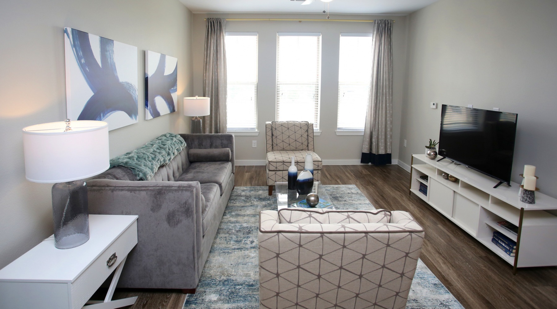 Relax and unwind in spacious living areas Living room with couch and windows