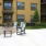 a patio with tables and chairs