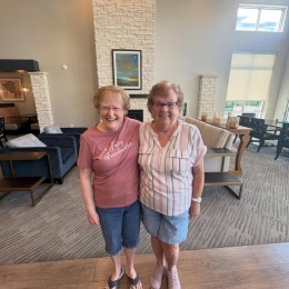two people posing together smiling