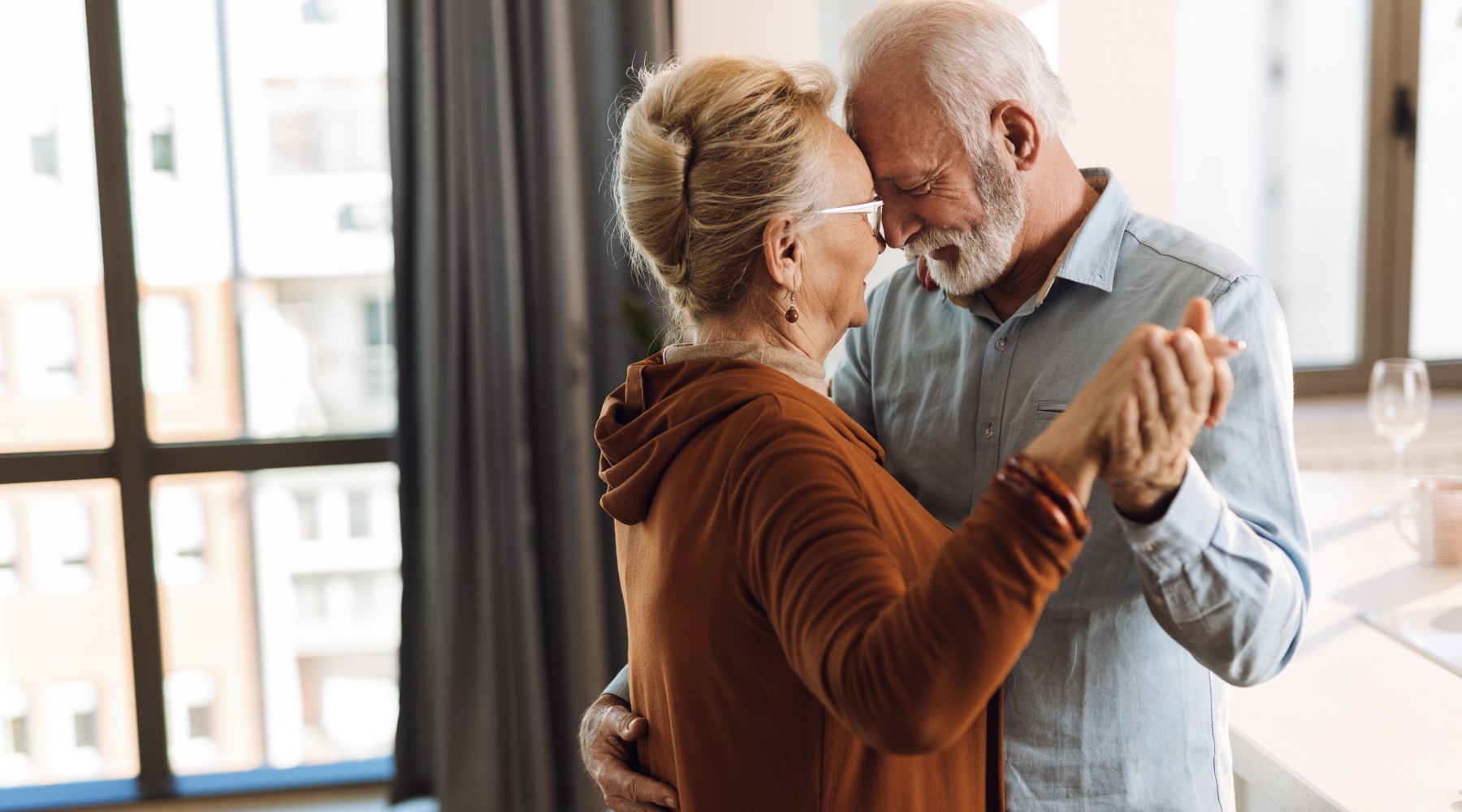 two people dancing and holding hands