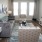 a living room with a tv and couches
