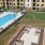 a large building with a pool