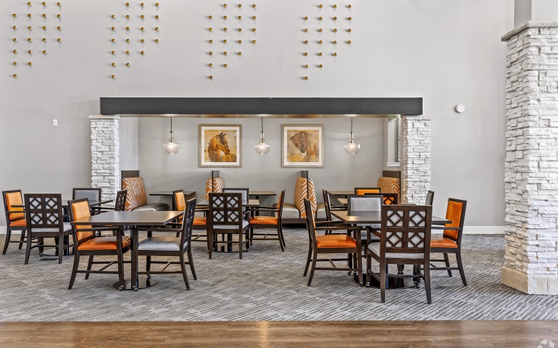 a clubhouse with tables and chairs to gather