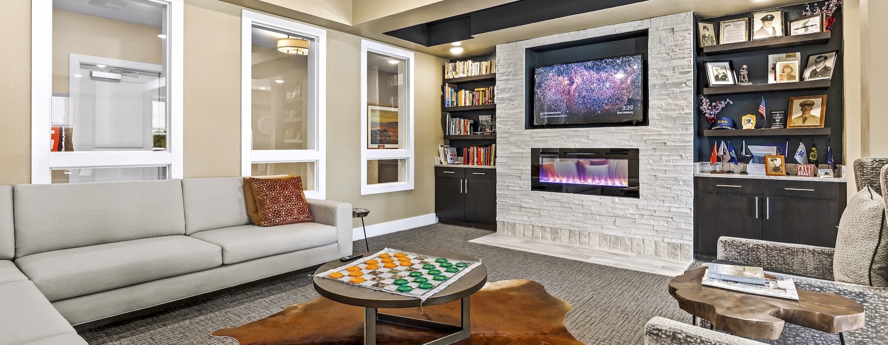 lounge with tv fireplace seating and shelving