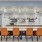 a kitchen with a bar and chairs