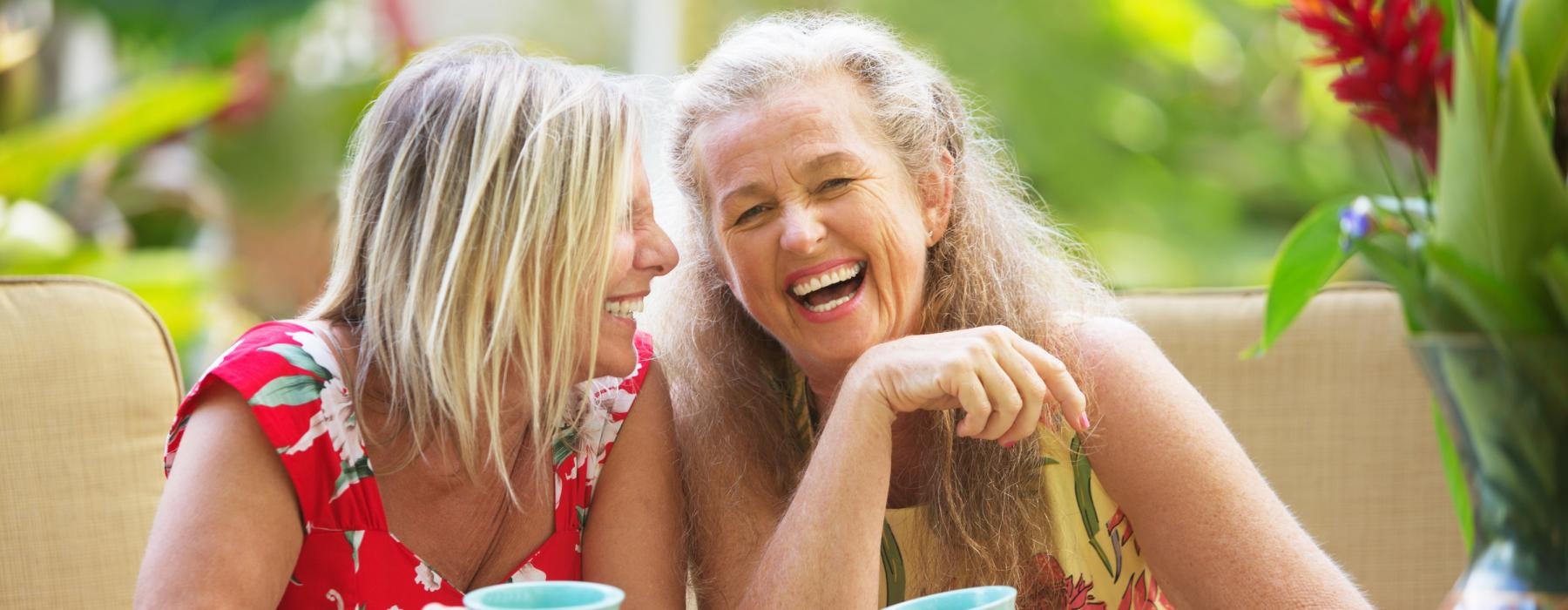 two woman laughing