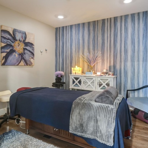 Take advantage of all The Orchards at Arlington Highlands has to offer Model bedroom at The Orchards at Arlington Highlands apartments in Arlington, TX, featuring wood grain flooring.